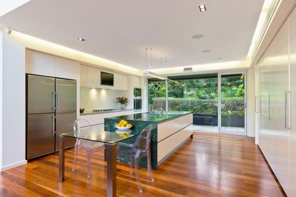 modern minimalist kitchen design wood flooring white cabinets green countertop