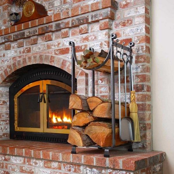 rustic fireplace design brick surroundings wrought iron wood holder