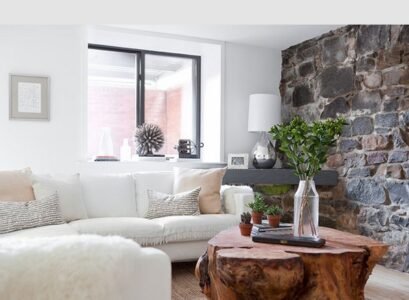 small-living-room-ideas-stone-wall-white-sofa-tree-trunk-coffee-table