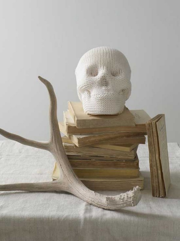 white halloween decoration ideas skull pile of books