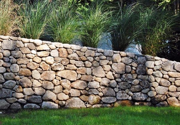 Rustic boulder stone blocks garden wall 