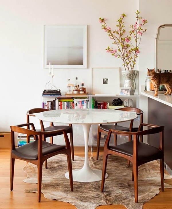 elegant dining room decorating ideas Eero Saarinen tulip table cowhide rug