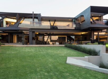 modern-home-exterior-glass-facade-polished-concrete-flooring-modern-interiors