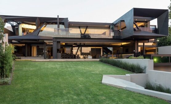 modern-home-exterior-glass-facade-polished-concrete-flooring-modern-interiors