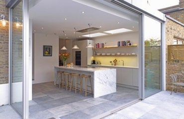 contemporary-kitchen-extension-ideas-glazed-sliding-doors-skylights-modern-lighting