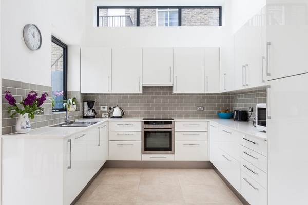white kitchen cabinets gray tile backsplash