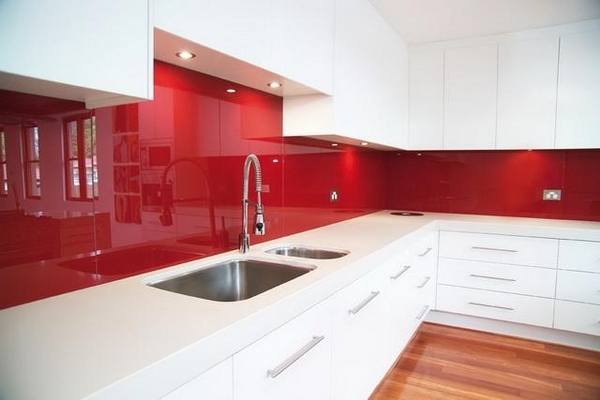 red glass splashback white cabinets