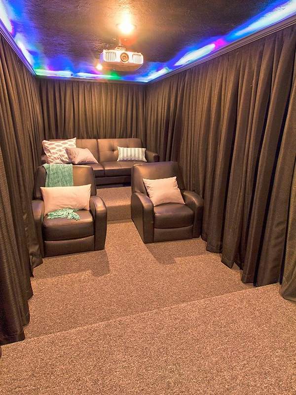 soundproof-curtains-home-theater-design-brown-curtains-leather-armchiars