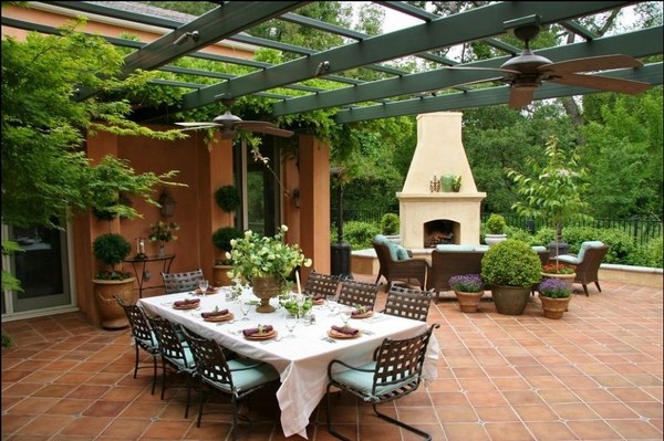 Mediterranean-patio-decor-ideas-Saltillo-tile-floor-pergola-dining-furniture-outdoor-fireplace