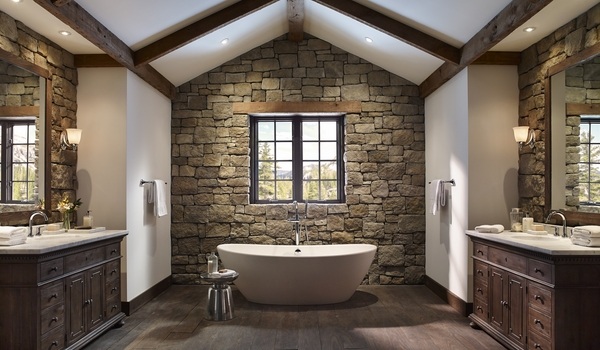 Rustic bathroom decor stone walls freestanding tub exposed ceiling beams
