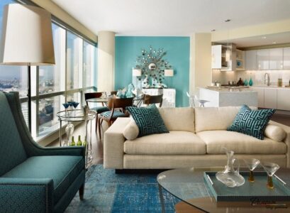 contemporary-open-plan-living-room-teal-accent-wall-white-sofa-teal-armchair-sofa-pillows