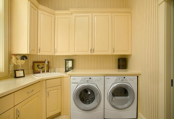 laundry-room-cabinets-ideas pastel yellow color built in washer dryer