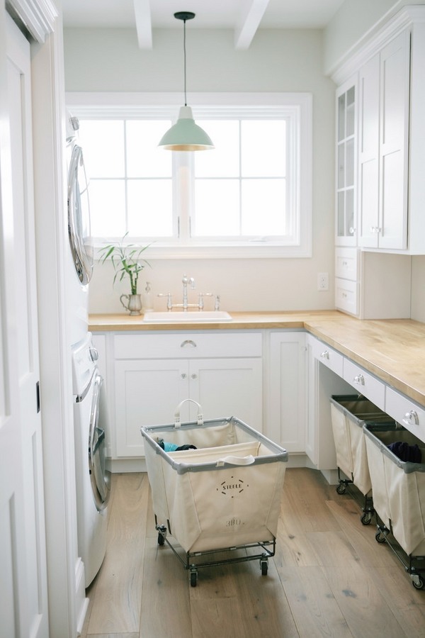 laundry-room-cabinets-ideas white cabinets wood countertops 