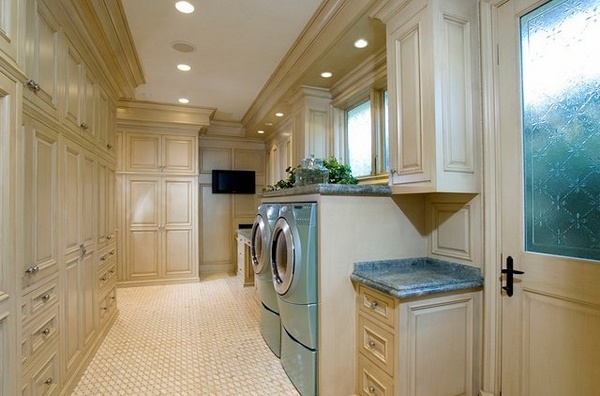 laundry room ideas blue washer dryer beige cabinets tile flooring