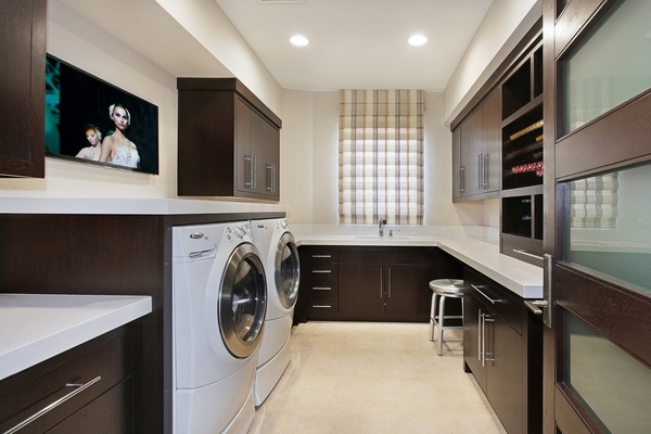 modern-laundry-room-cabinets-dark wood white countertops