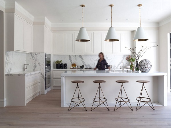modern white kitchen with calacatta marble slab countertops breakfast bar