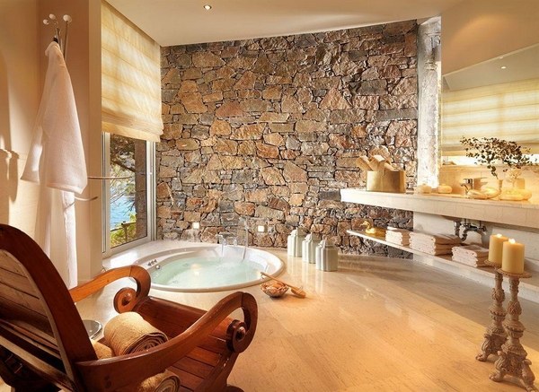 bathroom decor accent wall stone wall bathtub wood floor