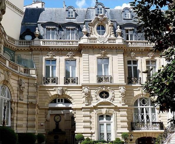 traditional mansard roof design ornate windows 