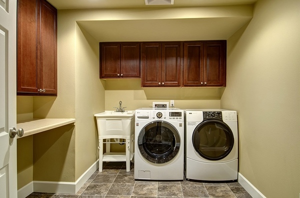 Basement renovation laundry wood cabinets countertop