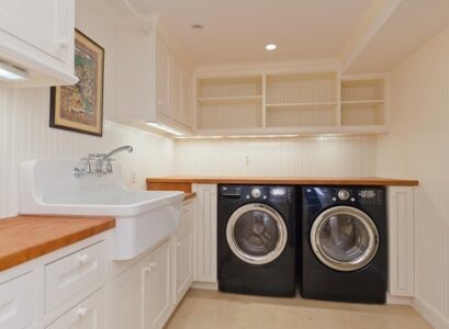 basement-laundry-room-ideas-white-cabinets-farmhouse-sink-wood-countertop