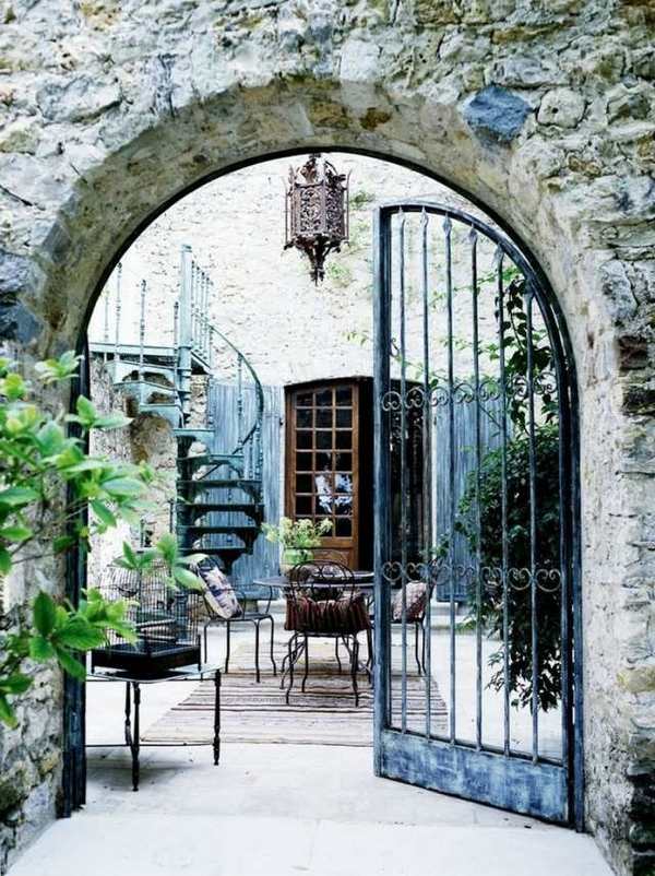 metal-garden-gates-swing-wrought-iron-gate-stone-wall-house-exterior 
