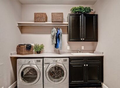 small-laundry-room-design-ideas-black-laundry-cabinets-open-shelf-storage-baskets