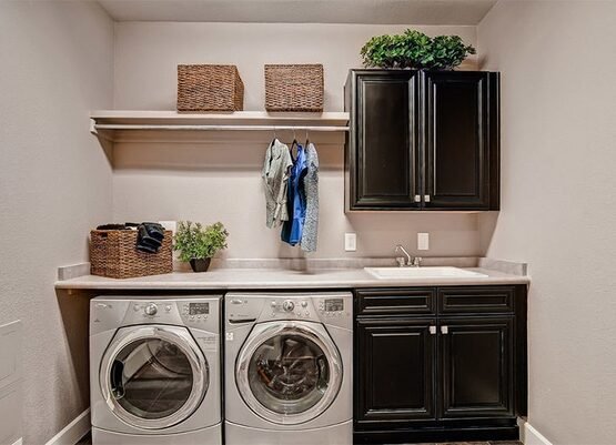 small-laundry-room-design-ideas-black-laundry-cabinets-open-shelf-storage-baskets
