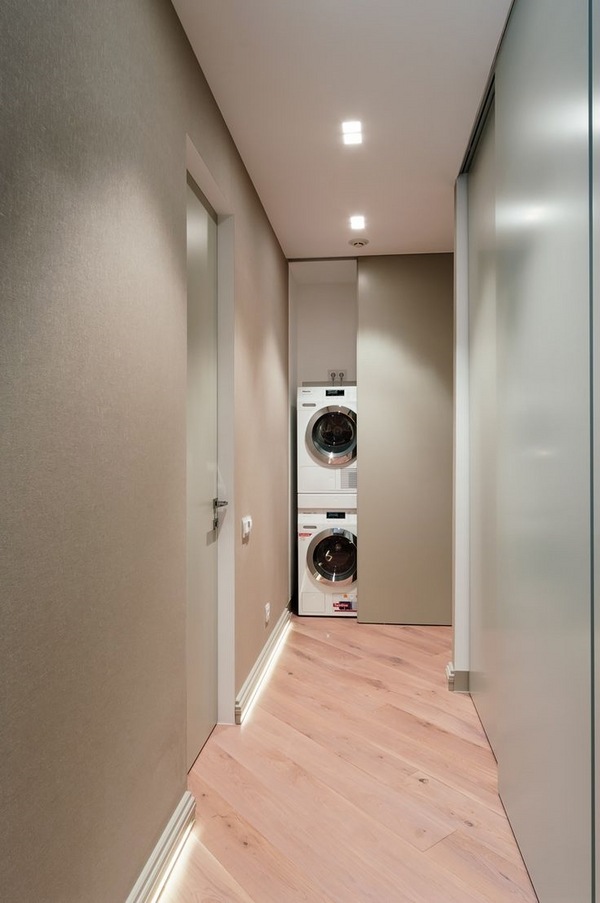 small-laundry-room-design-ideas-sliding-door-stackable-washer-and-dryer