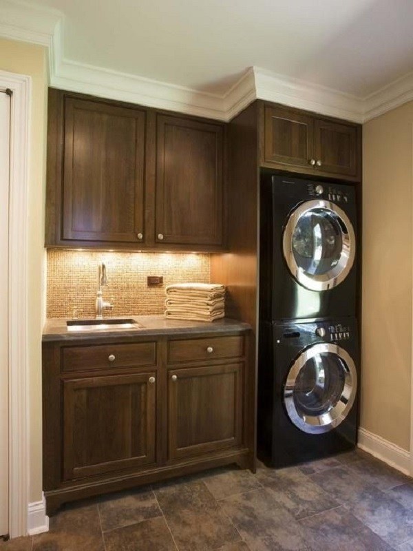 dark wood cabinets stacked washer dryer