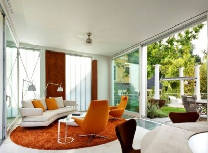 sunroom-additions-furniture-ideas-modern-white-sofa-round-orange-carpet