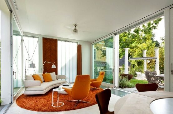 sunroom-additions-furniture-ideas-modern-white-sofa-round-orange-carpet
