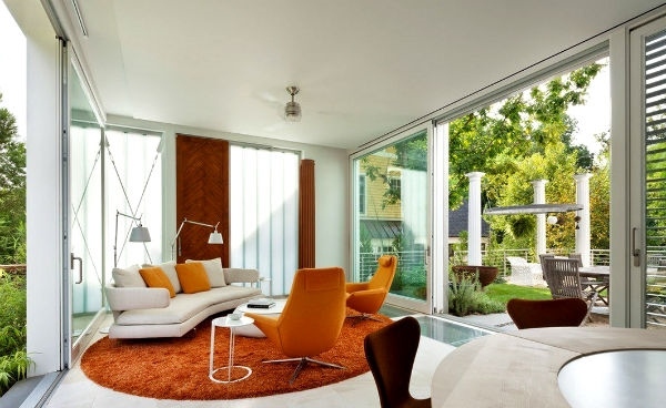 sunroom additions furniture ideas modern white sofa round orange carpet
