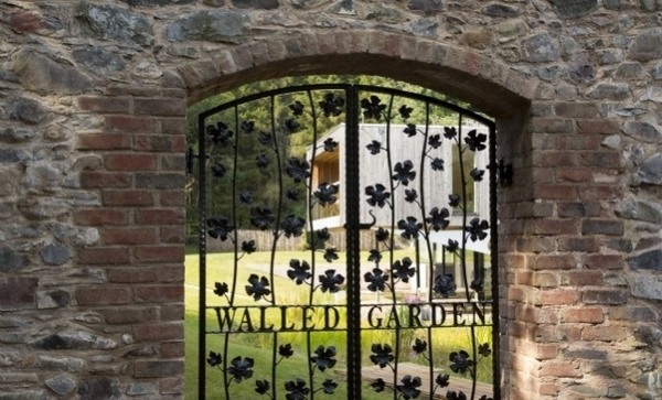 walled garden design ideas wrought iron gate 