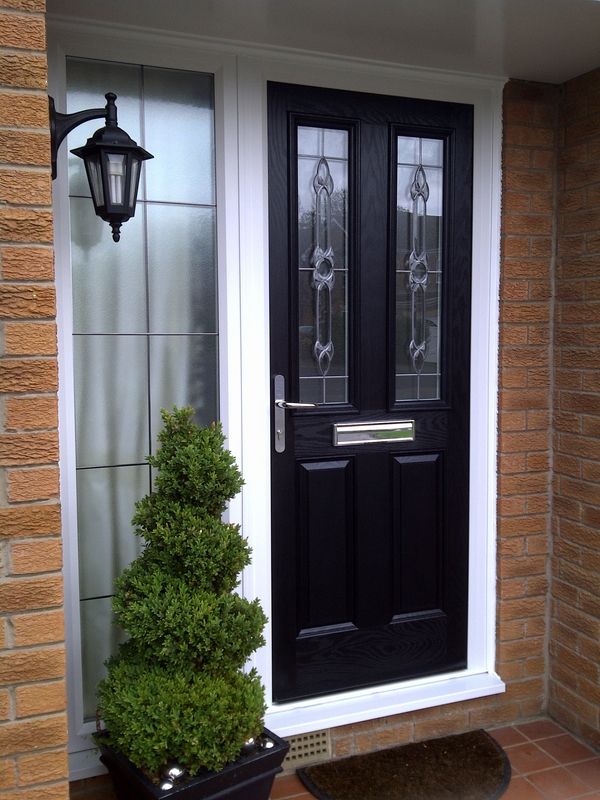 Composite front door black door white trim house exterior