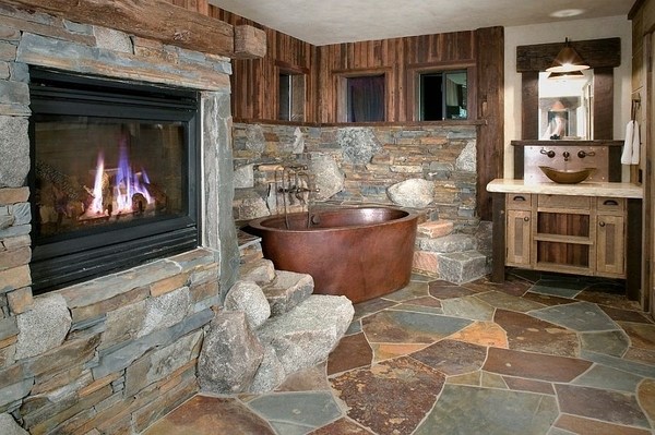 copper bathtub stone fireplace flagstone floor