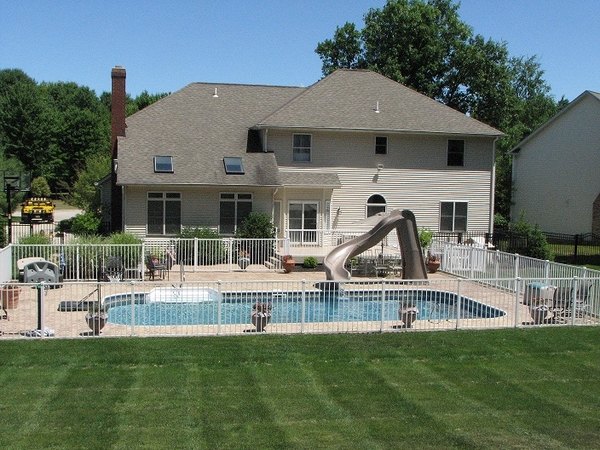 Aluminum pool fencing backyard with slide lawn
