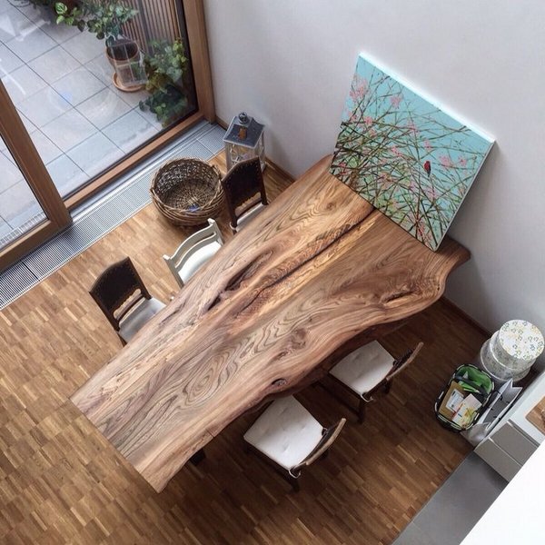 Wood slab dining table designs in rustic and modern interiors