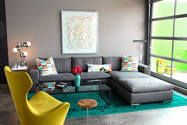 Modern living room gray sofa green overdyed rug gray wall paint
