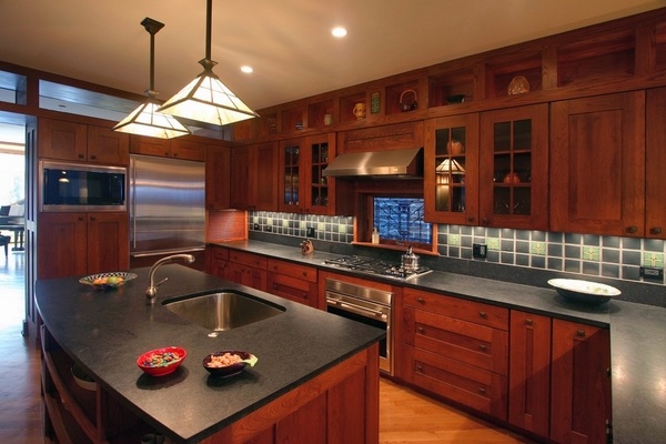 craftsman kitchen black countertop wood cabinets