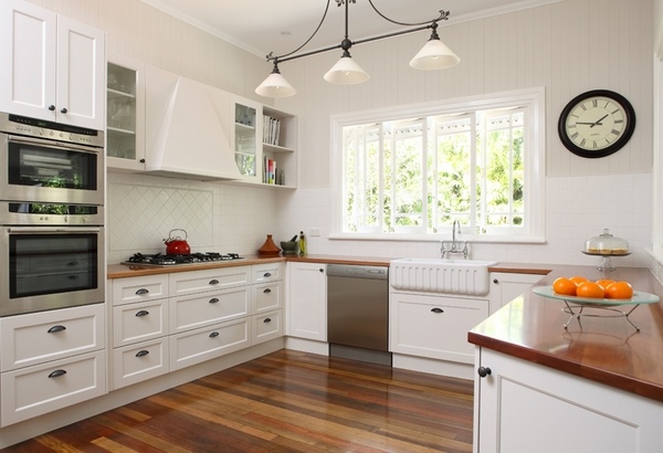 kitchen-remodel-ideas-white-shaker-style-kitchen-cabinets-farmhouse-sink-wood-flooring