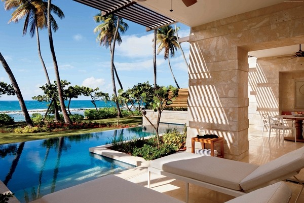 tropical landscape pool deck sunbeds