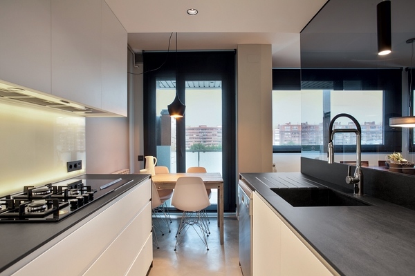 Black Neolith countertop white kitchen cabinets modern kitchen 