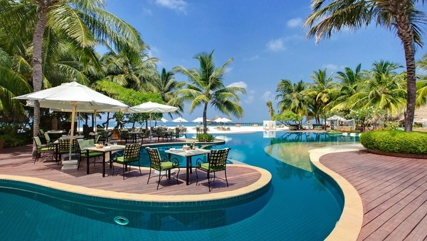 tropical-pools-tables white parasols pool deck ideas