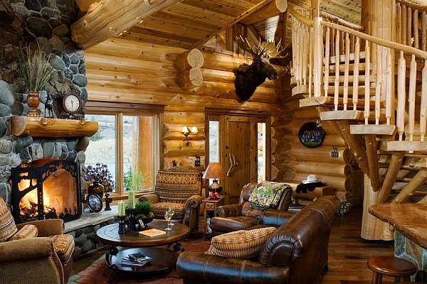 log-cabin-decor-ideas-leather furniture stone fireplace round coffee table