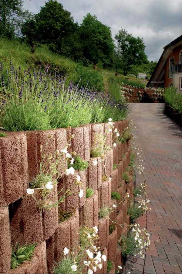 cheap retaining cinder block wall concrete planters flowers 