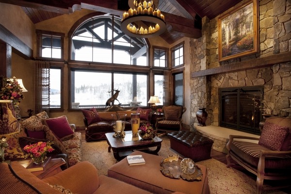 log-cabin-decor-ideas-rustic-living-room-brown-sofas-chandelier 