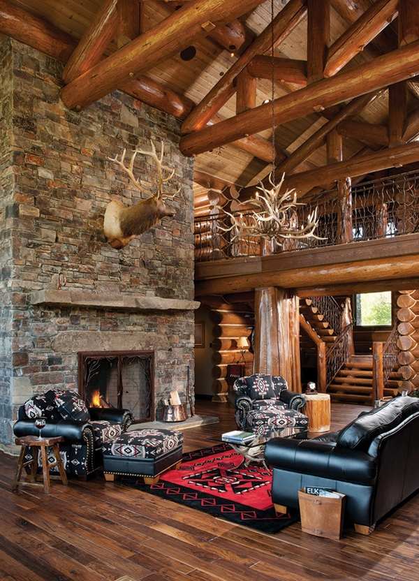 log-cabin-furniture-ideas-rustic living room stone fireplace black antler chandelier