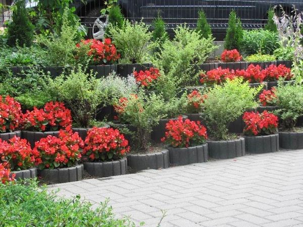  red begonias retaining wall ideas cinder block concrete planters