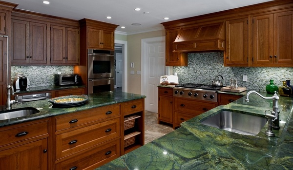 green granite traditional kitchen wood cabinets