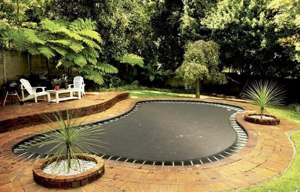 large trampoline backyard landscape